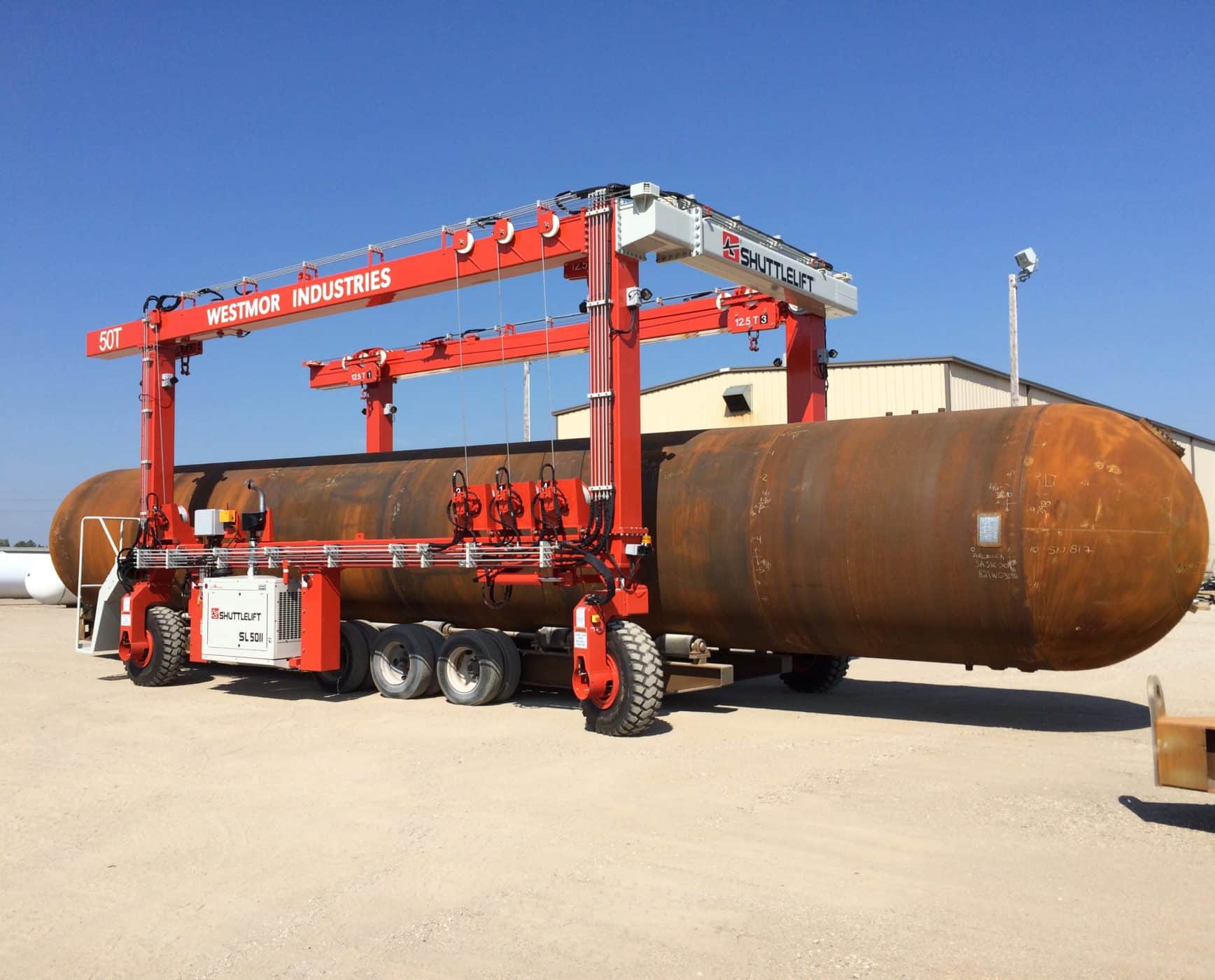 SL Series rubber-tired gantry crane hauling large steel tank